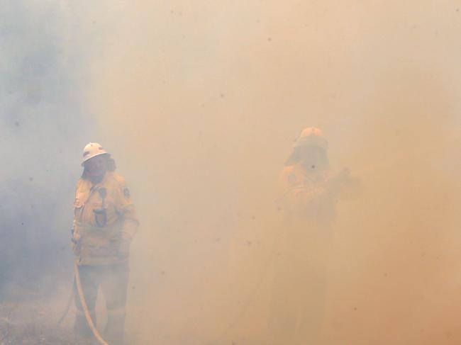 Thick smoke envelops firefighters. Picture Gary Ramage