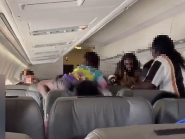 Australian Federal Police and NT Police arrested four passengers over an alleged brawl on a flight from Cairns to Darwin, via Groote Eylandt, on Thursday April 20.