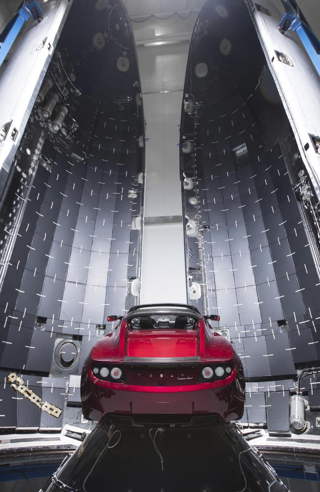 Musk's Tesla car next to the fairing of a Falcon Heavy rocket in Cape Canaveral, Florida.