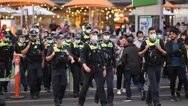 Police are out in force after Melburnians were urged to stay home unless they had a booking in the city. Picture: David Crosling