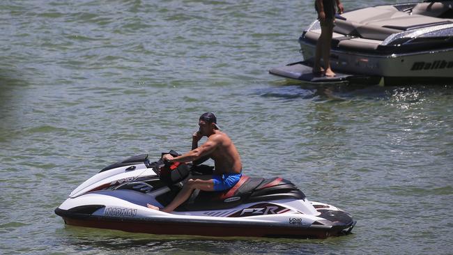 A man without a life vest on a jetski on his phone near Lilli Pilli. Picture: Dylan Robinson