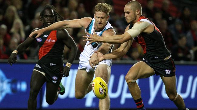 Tom Jonas of the Power contests with David Zaharakis of the Bombers.