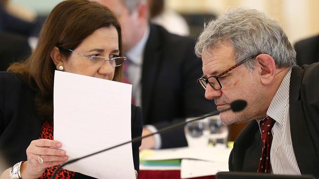 Queensland Premier Annastacia Palaszczuk speaks with Chief of staff David Barbagallo during estimate hearings at Queensland Parliament in Brisbane, Tuesday, July 23, 2019. (AAP Image/Jono Searle) NO ARCHIVING