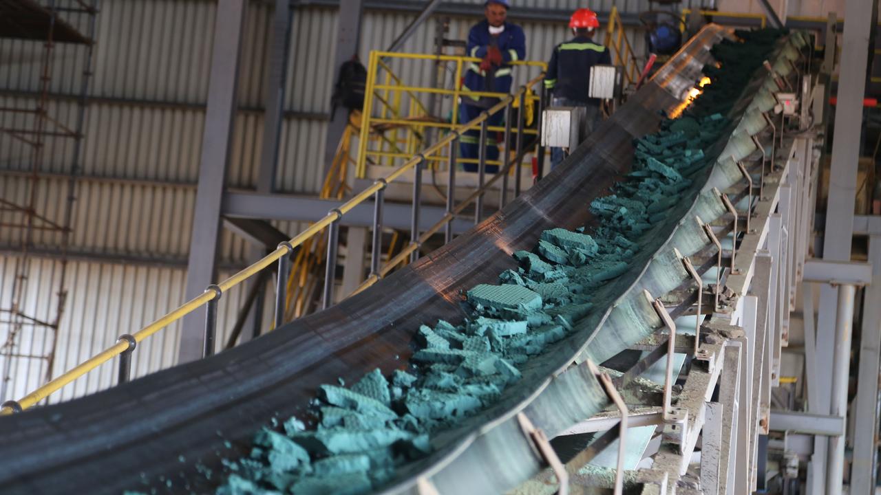 A conveyor belt carries chunks of raw cobalt being exported to China for refining. Picture: AFP Photo / Samir Tounsi