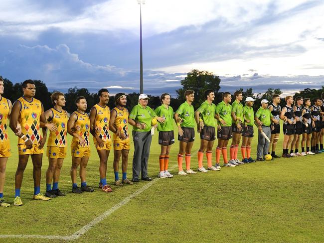 Wanderers and Palmerston football club players linked arms before the NO MORE Round fixture at Cazalys Arena. Picture: Felicity Elliott.