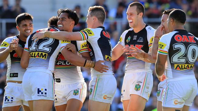 Penrith players celebrate a try.