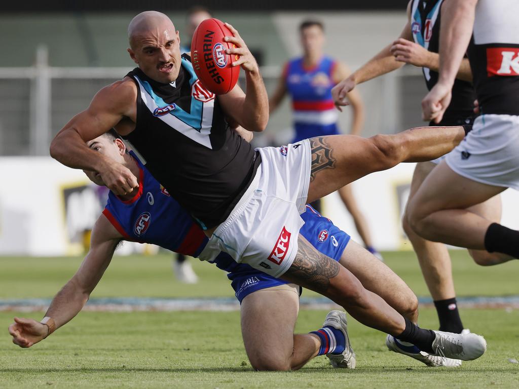 Sam Powell-Pepper can’t get away from Matthew Kennedy. Picture: Michael Klein