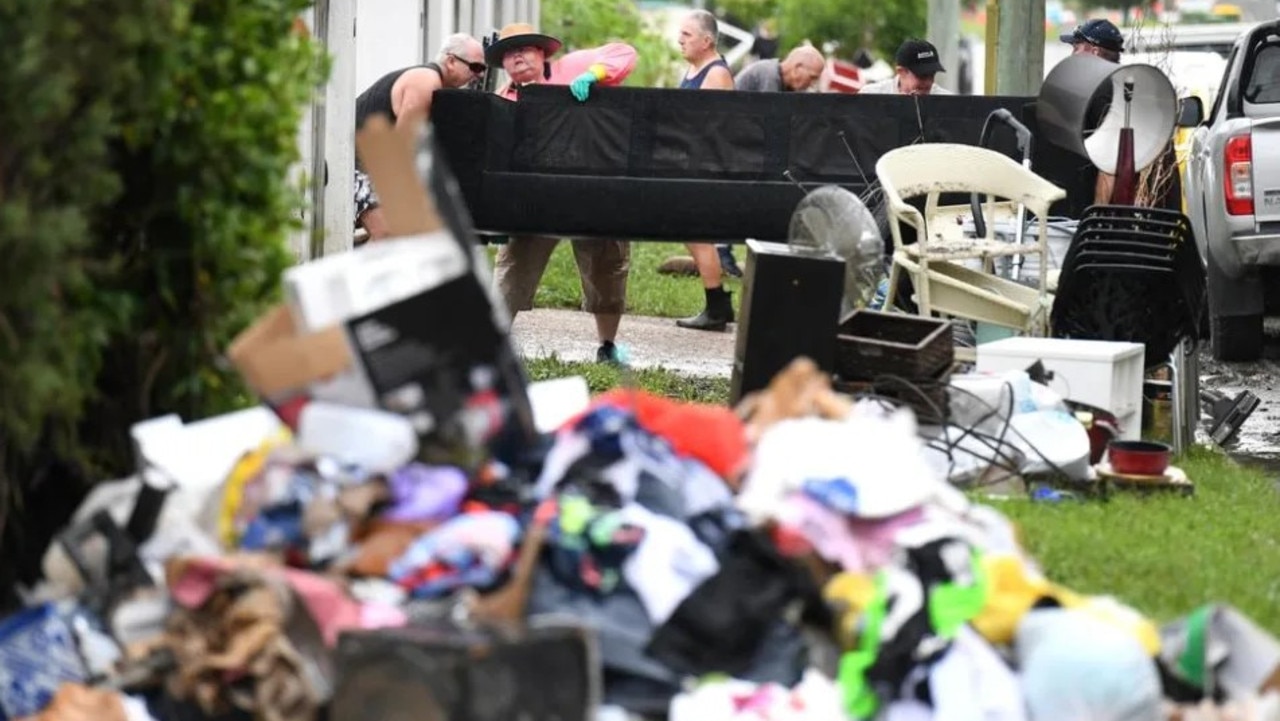 Flood-damaged items from homes in the suburb of Rosslea in Townsville, in 2019. Picture: AAP Image/Dan Peled.