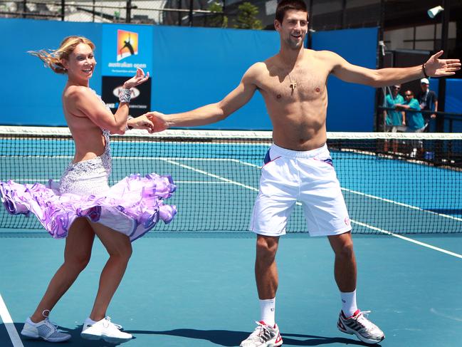 Novak Djokovic gets a dance lesson from US Dancing with the Stars host Kym Johnson at the 2011 Australian Open.