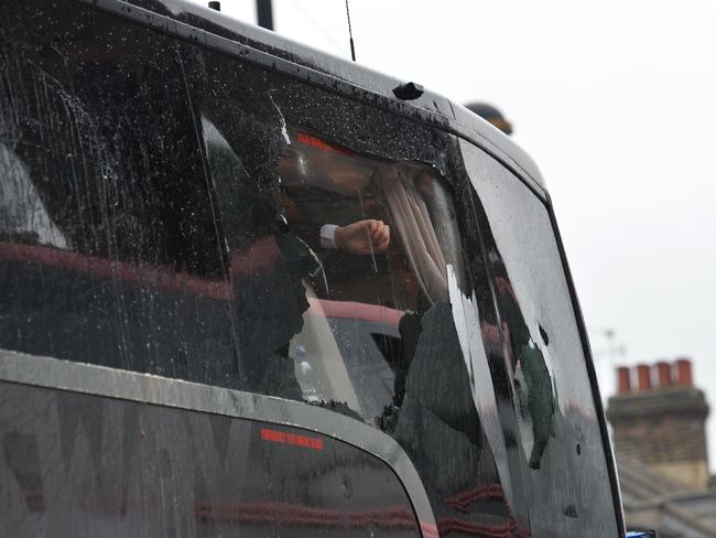 The smashed window on Man United’s team bus.