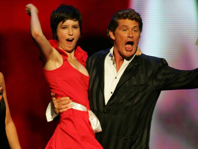 Missy Higgins jumps into the arms of actor David Hasselhoff after winning Album of the Year at the 2005 ARIA Awards.