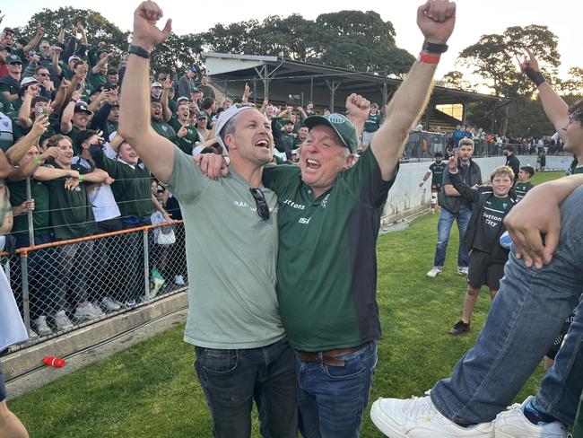 Randwick coach Stephen Hoiles and general manager Mark Harrison celebrate the club's 2023 Shute Shield grand final premiership win.