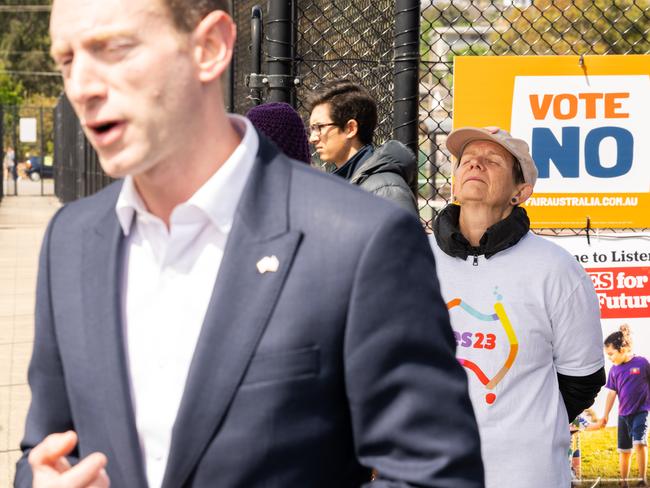 A woman volunteering for the YES23 campaign reacts to comments that South Australian Opposition Leader David Speirs makes while speaking to media. Picture: Morgan Sette/NCA NewsWire