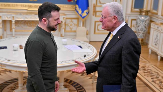 Ukraine's President Volodymyr Zelensky greets US special envoy for Ukraine Keith Kellogg at his offices in Kyiv on February 20, 2025, amid the Russian invasion of Ukraine. (Photo by Sergei SUPINSKY / AFP)