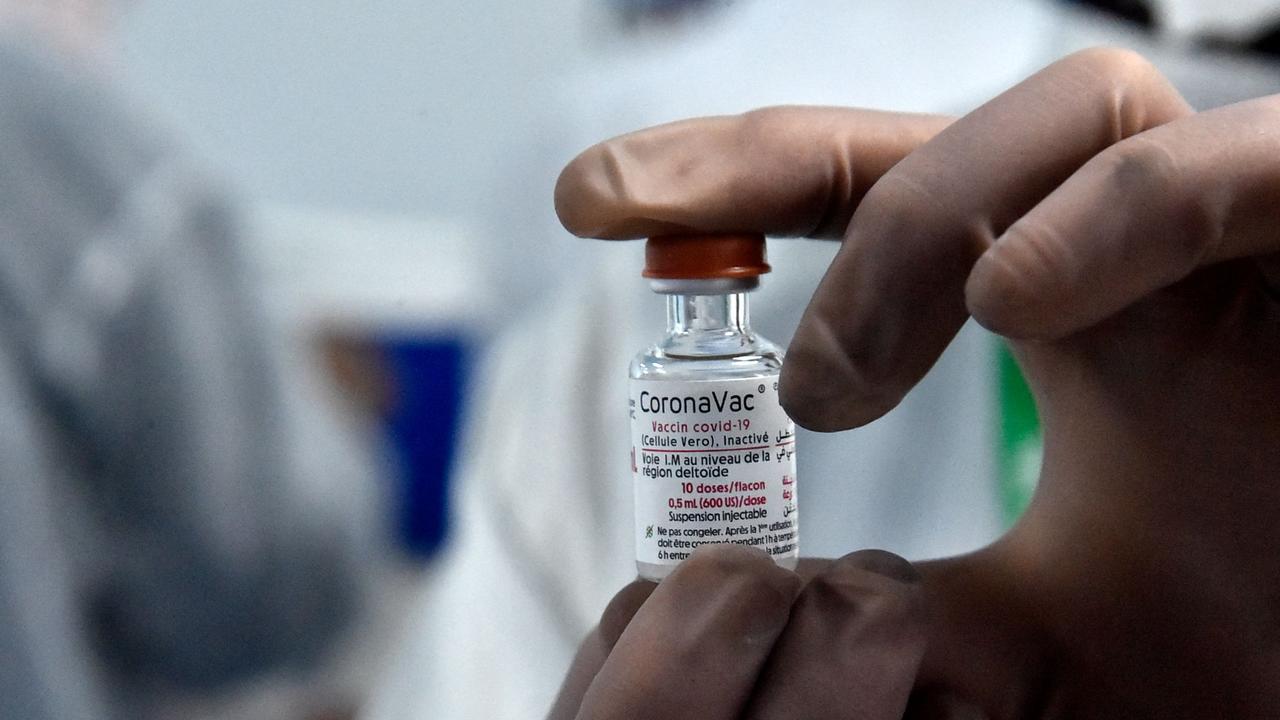 Chinese-developed Sinovac (CoronaVac) Covid-19 vaccine is one of the two ‘recognised vaccines’ announced by the TGA ahead of Australia’s reopening. Picture: RYAD KRAMDI / AFP