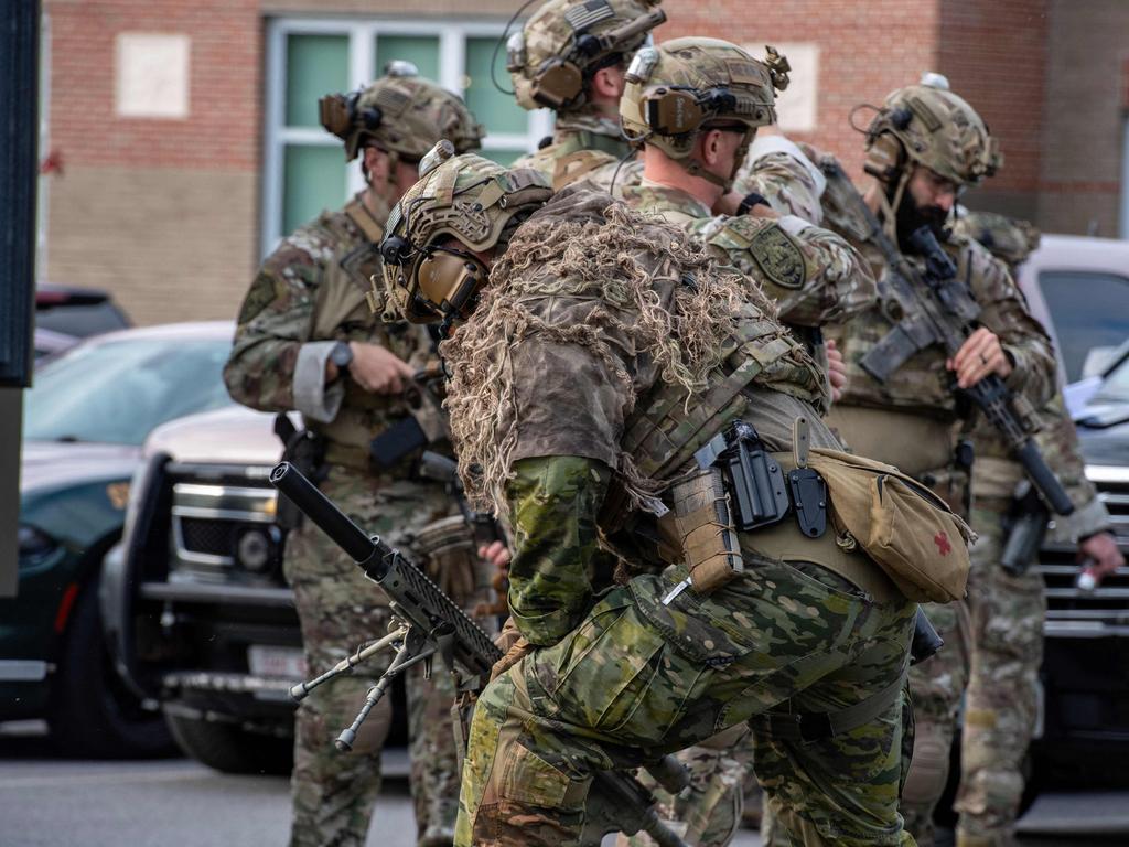 Soldiers joined the manhunt for a gunman who killed 18 people. Picture: AFP