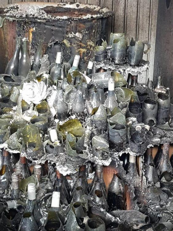 Broken wine bottles at Tilbrook Estate Winery, which was destroyed by bushfires.