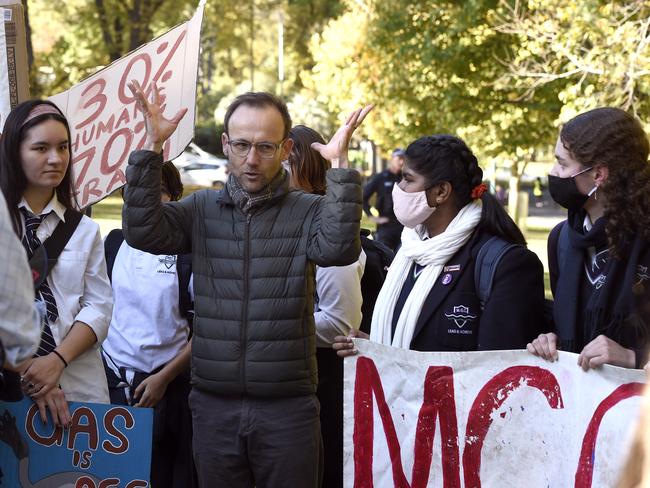 Bandt joins protesters in Treasury Gardens to call for action on climate change. Picture: Andrew Henshaw