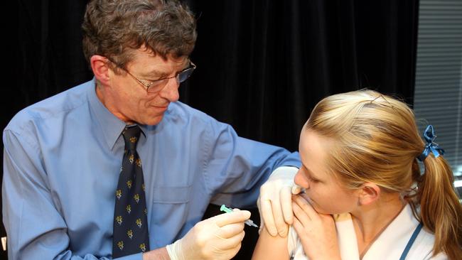 Professor Ian Frazer delivers the first dose of Gardasil vaccination against cervical cancer at the PA Hospital to Emma McMillan, 13, in 2006.