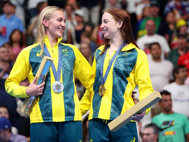 Ariarne Titmus and Mollie O'Callaghan celebrate on the podium. Picture: Getty Images