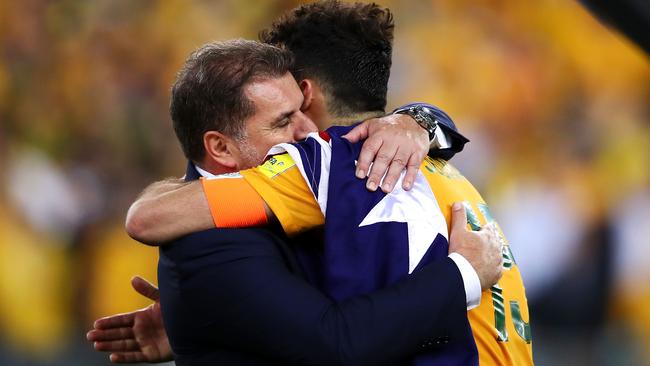 Ange Postecoglou and Mile Jedinak of Australia celebrate victory over Honduras.