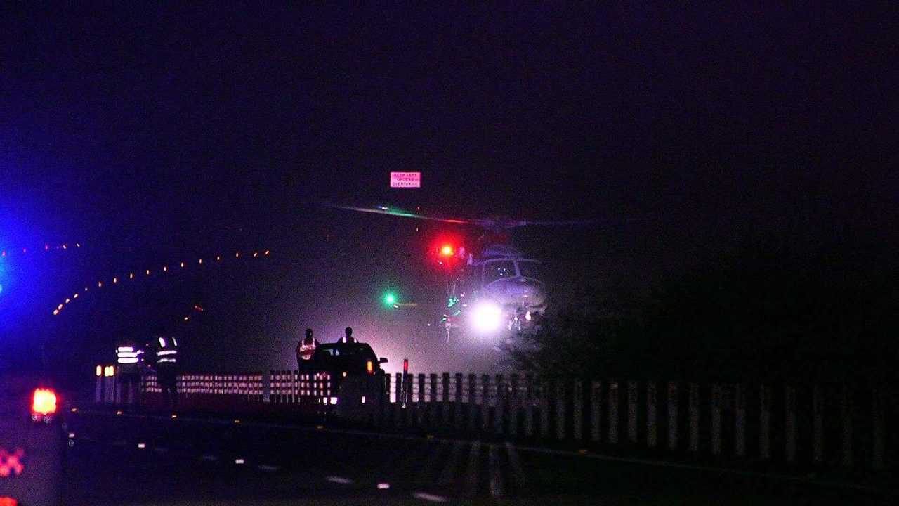 DEPLOYED: The Westpac Life Saver Rescue Helicopter has landed at the scene of a single-vehicle crash on the Pacific Highway near Halfway Creek. Picture: Frank Redward