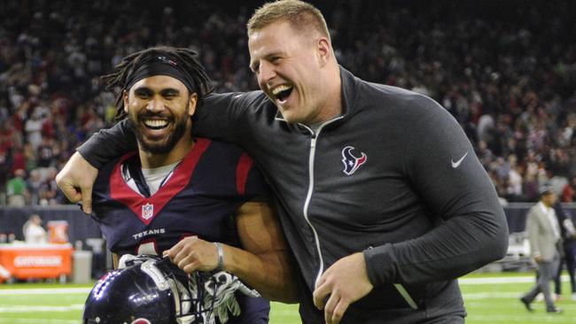 Houston Texans' J.J. Watt, right, and Jonathan Grimes celebrate after beating the Cincinnati Bengals.