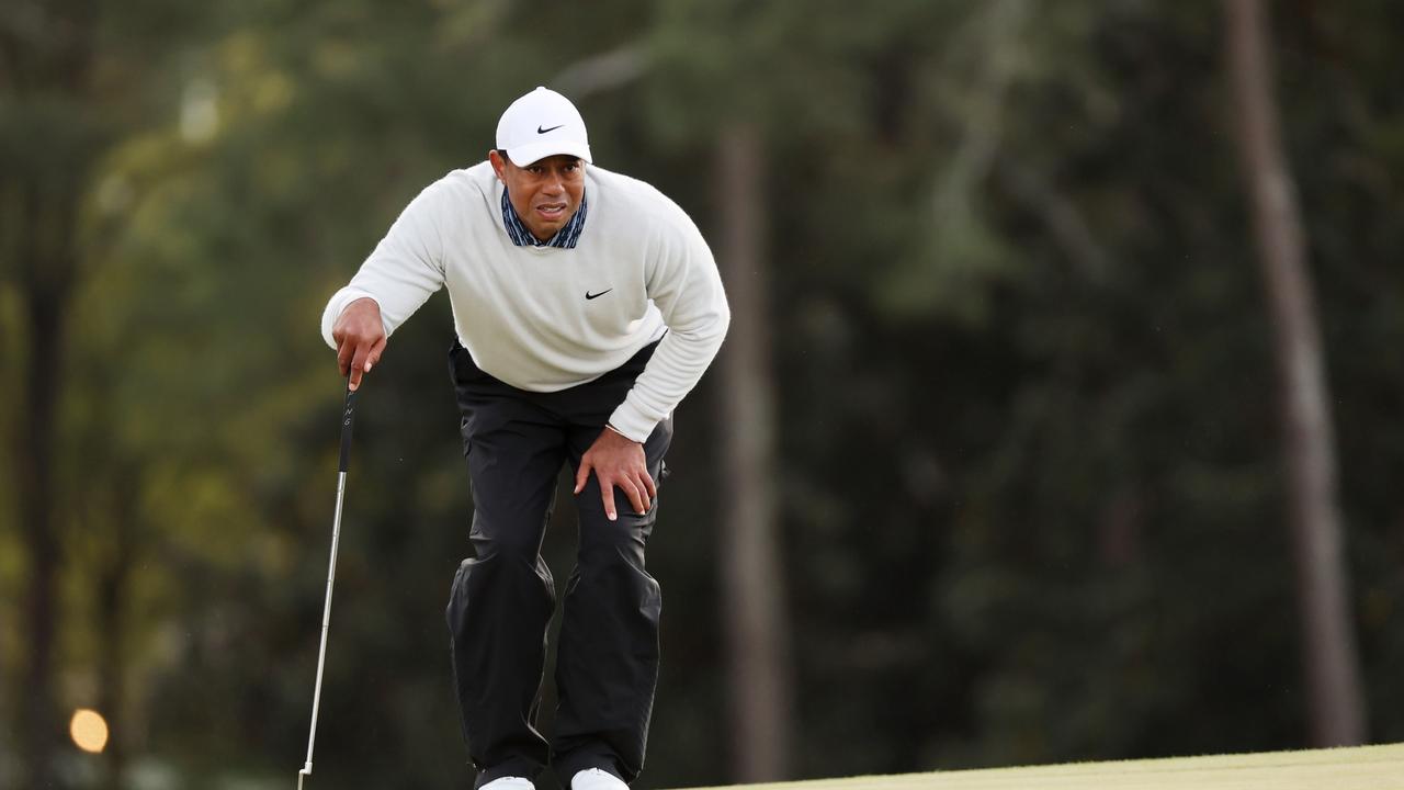 AUGUSTA, GEORGIA – APRIL 09: Tiger Woods lines up a putt on the 18th green during the third round of the Masters at Augusta National Golf Club on April 09, 2022 in Augusta, Georgia. (Photo by Gregory Shamus/Getty Images)
