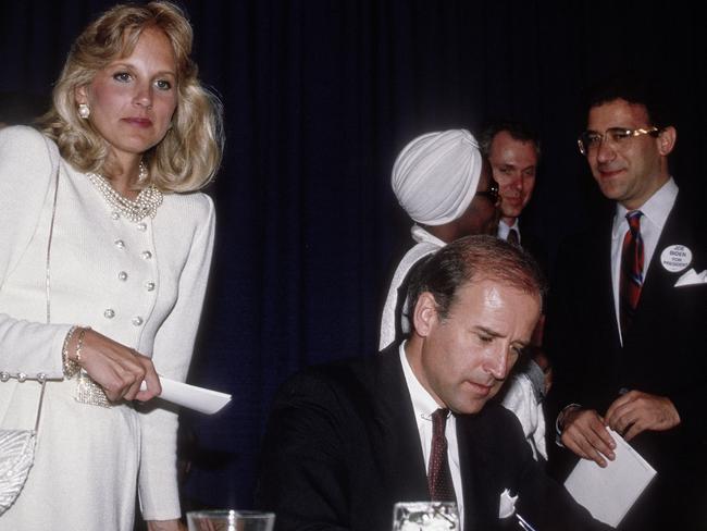 Jill Biden (left) stands behind her husband, then-Senator Joe Biden, after his keynote address to an Illinois Democratic Party dinner in Chicago, Illinois, in 1987. Picture: Getty Images