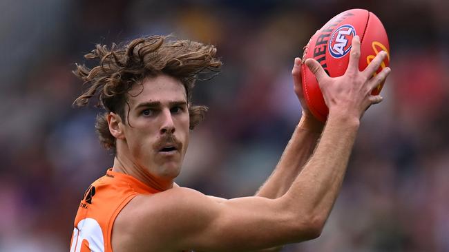 BRISBANE, AUSTRALIA - AUGUST 10: James Peatling of the Giants handles the ball during the round 22 AFL match between Brisbane Lions and Greater Western Sydney Giants at The Gabba, on August 10, 2024, in Brisbane, Australia. (Photo by Albert Perez/AFL Photos via Getty Images)