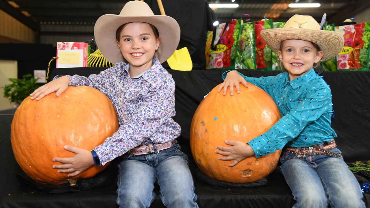 Isla Martin (9) and her sister Lacey Martin (6) and their prize winning pumpkins. Heritage Bank Toowoomba Royal Show. Saturday March 26, 2022