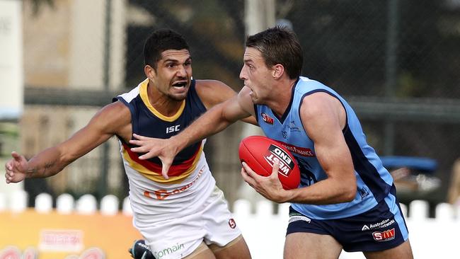 Reigning Jack Oatey Medallist Fraser Evans fends off Curtly Hampton in Round 2. Picture: Sarah Reed