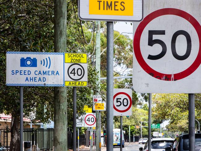 16th January 2023.The Daily Telegraph. News.Moore Park,  Sydney, NSW, Australia.Pics by Julian Andrews.Photograph shows a cluster of speed signs and a speed camera sign on Cleveland Street at the junction with South Dowling Street in Moore Park, Sydney.Picture to illustrate story about demerit points expiring faster for safe drivers who avoid traffic infringements if Chris Minns wins the March election.