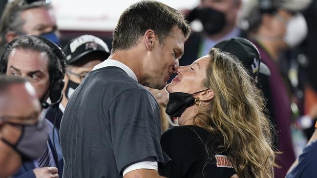 Tampa Bay Buccaneers quarterback Tom Brady kisses wife Gisele Bundchen after defeating the Kansas City Chiefs in the NFL Super Bowl 55 football game Sunday, Feb. 7, 2021, in Tampa, Fla. The Buccaneers defeated the Chiefs 31-9 to win the Super Bowl. (AP Photo/Mark Humphrey)