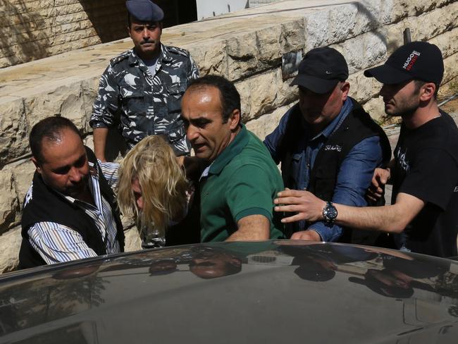 Lebanese policemen surround Australian TV presenter Tara Brown. Picture: Supplied.