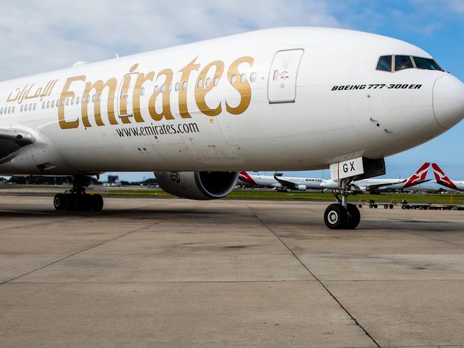 SYDNEY, AUSTRALIA - FEBRUARY 28:  An Emirates airlines plane moves down the runway transporting the AstraZeneca COVID-19 vaccine as the first vaccination doses arrive into the country at Sydney International airport on February 28, 2021 in Sydney, Australia. The Oxford-AstraZeneca vaccine is the second vaccine to arrive in Australia. 300,000 doses arrived in today's shipment. The Therapeutic Goods Administration (TGA) will now batch-test the vaccines to ensure they meet Australia's strict quality standards. (Photo by Edwina Pickles - Pool/Getty Images)