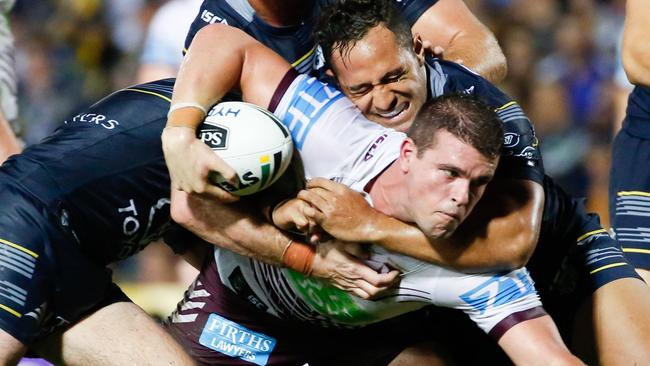 Sea Eagles' Darcy Lussick tackled by Cowboys' defence including from left, Jake Granville, Scott Bolton (at back) and Patrick Kaufusi during the Round 16 NRL match between the North Queensland Cowboys and the Manly Sea Eagles at 1300 Smiles Stadium in Townsville, Monday, June 27, 2016. (AAP Image/Michael Chambers) NO ARCHIVING, EDITORIAL USE ONLY