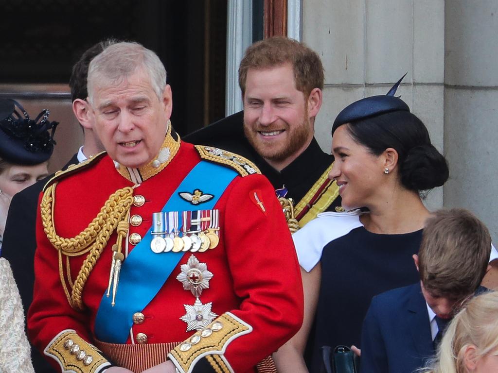 All smiles for now, but a lip reader claims Prince Harry was a little miffed that Meghan kept turning around to face him during Trooping The Colour. Picture: MATRIXPICTURES