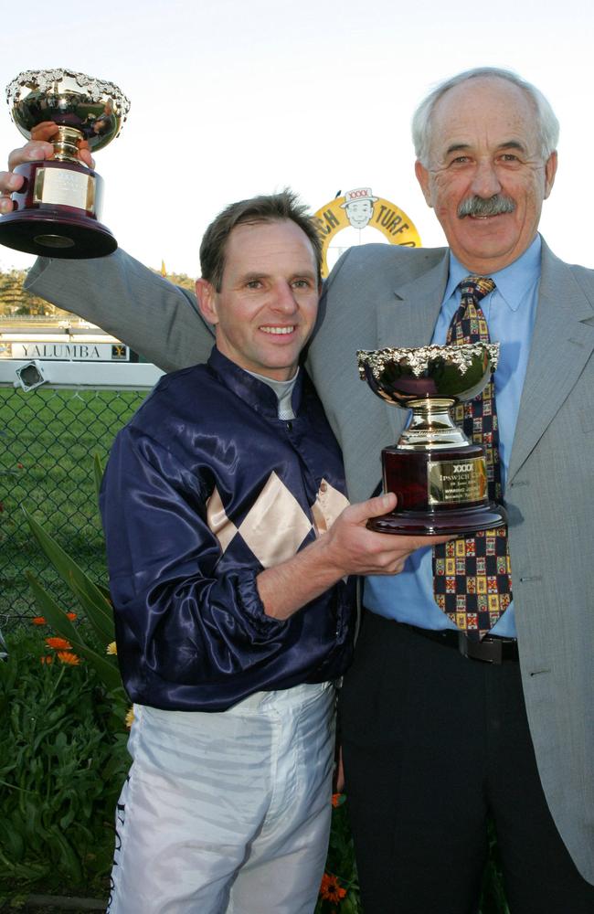 JUNE 19, 2004 : Jockey Larry Cassidy with trainer Neville McBurney with their trophies after their victory with rachorse Portland Singa in winning race 7, XXXX Ipswich Cup at Ipswich. Pic Bruce Long. Turf