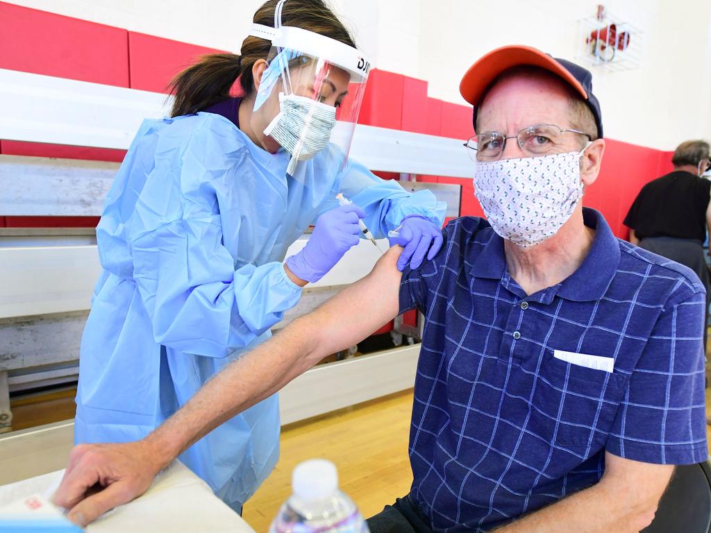 A man is vaccinated against Covid at clinic set up in a high school gym in California. Picture: AFP