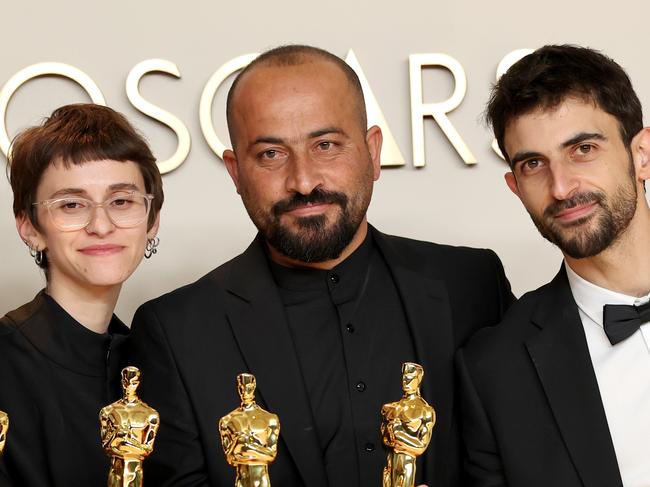 HOLLYWOOD, CALIFORNIA - MARCH 02: (L-R) Basel Adra, Rachel Szor, Hamdan Ballal, Yuval Abraham, winners of the Best Documentary Feature Film for “No Other Land”, pose in the press room during the 97th Annual Oscars at Ovation Hollywood on March 02, 2025 in Hollywood, California. (Photo by Mike Coppola/Getty Images)