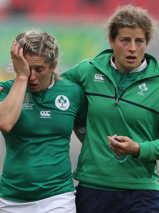 Alison Miller (L) of Ireland is comforted by a team mate after their defeat.