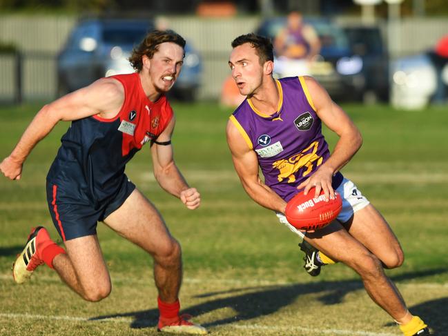 Corey Cassidy (right) of the Old Collegians Is seen in action during the VAFA Premier match at Brighton Beach Oval, Melbourne, Saturday, Jane 2, 2018. Old Brighton v Old Collegians. (AAP Image/James Ross) NO ARCHIVING