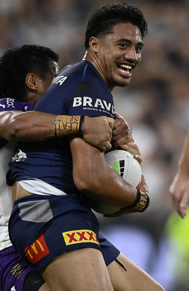 Murray Taulagi is tackled by Sualauvi Faalogo. (Photo by Ian Hitchcock/Getty Images)