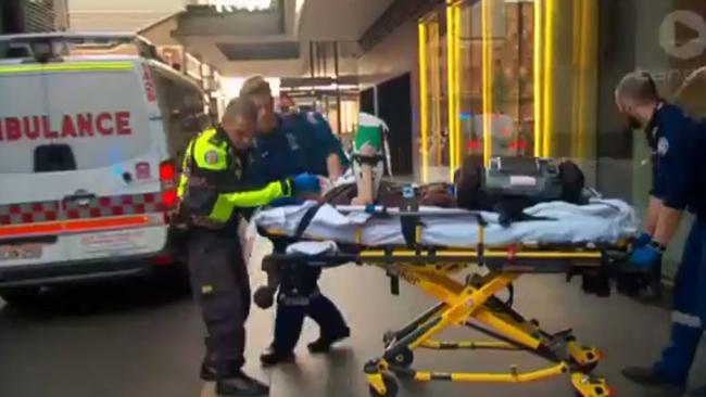 Paramedics rush Jean Huang to hospital. Picture: TEN News