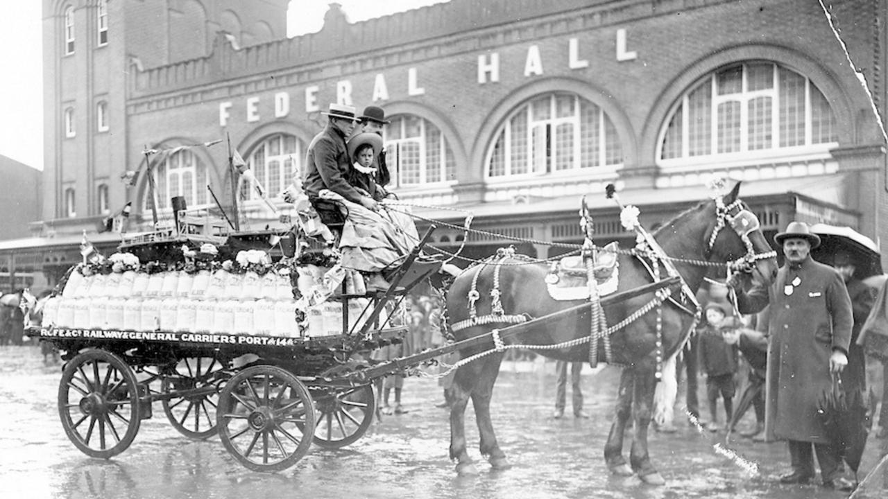 A decorated horse-drawn wagon outside the market’s Federal Hall on a rainy Labor Day, 1914. Picture: State Library PRG 280/1/11/132