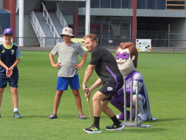 Fans watch on as Hurricanes player Charlie Wakim bats at Tuesday's fan day in Launceston. Picture: Jon Tuxworth