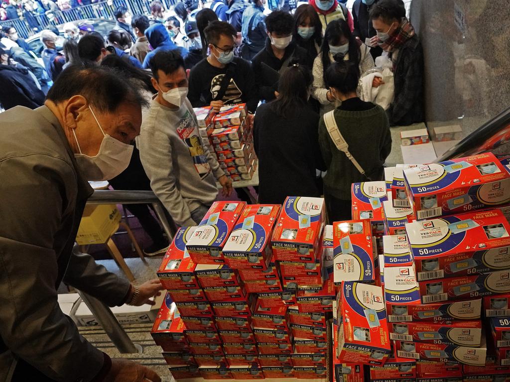 People line up to get their hands on masks in Hong Kong. Picture: AP Photo/Vincent Yu, File.