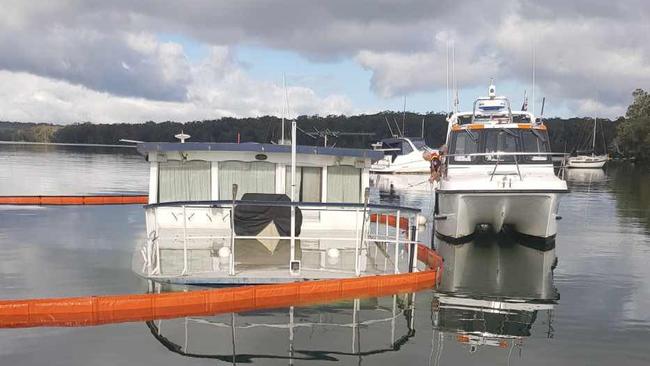 The old Stockton ferry has sunk in Gwandalan, causing a major diesel spill. Picture: Fire and Rescue NSW