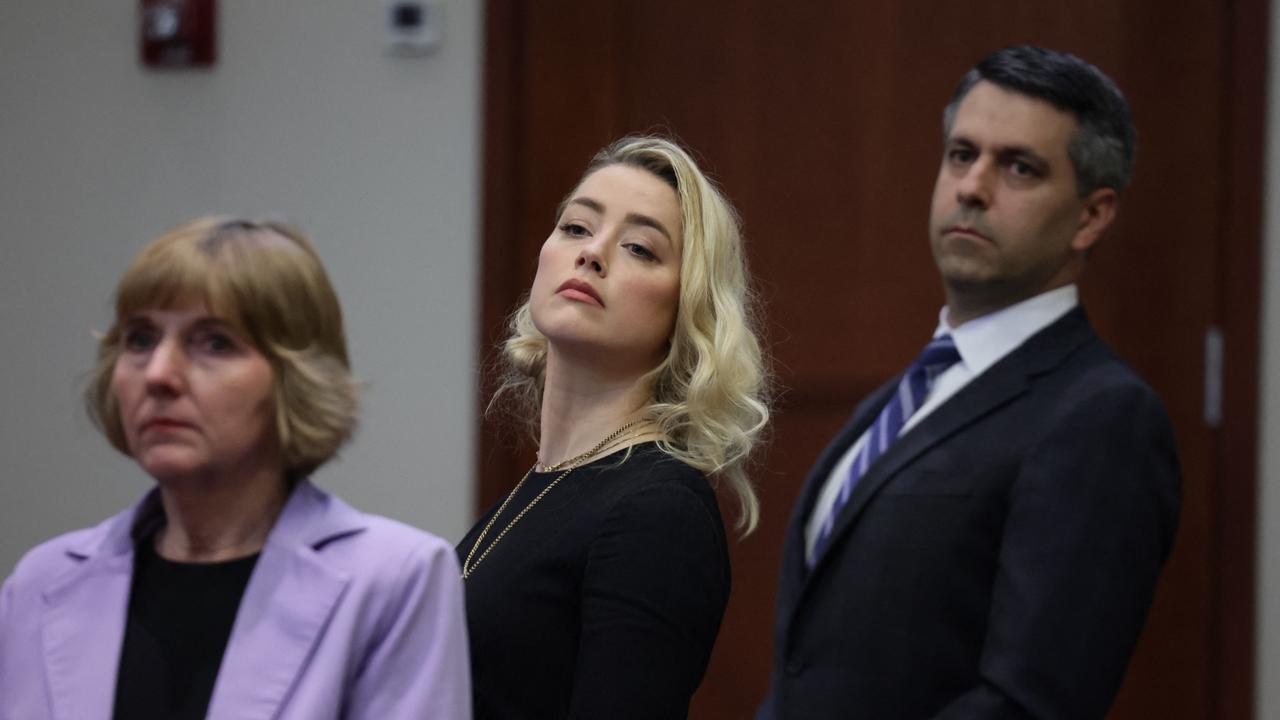 Amber Heard and her lawyers Elaine Bredehoft (left) and Benjamin Rottenborn. Picture: Evelyn Hockstein/AFP